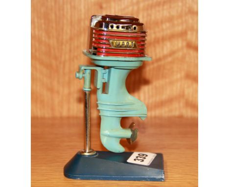 An unusual vintage outboard motor table lighter, H. 15cm.