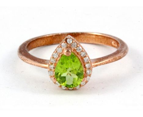 A 925 silver rose gold gilt peridot and white stone set cluster ring, (M).