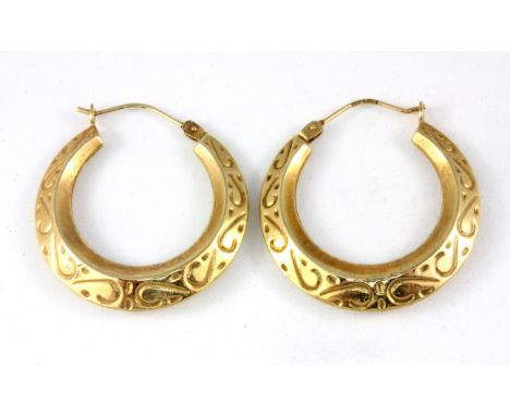 A pair of 9ct yellow gold hoop earrings, L. 3.2cm, W. 2.2g.
