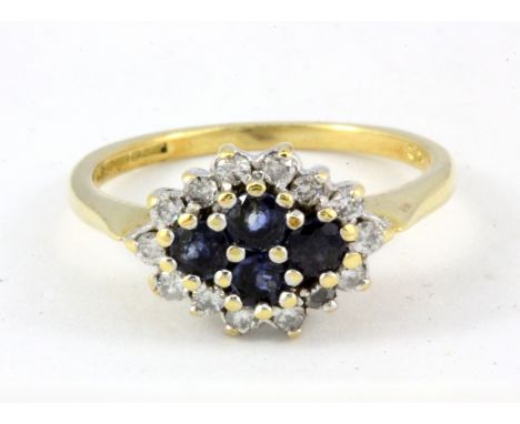 An 18ct yellow gold sapphire and diamond set cluster ring, (L).