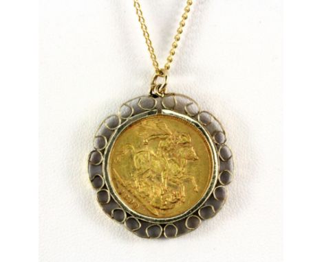 A 9ct yellow gold mounted full sovereign pendant and chain, W. 12.7g.
