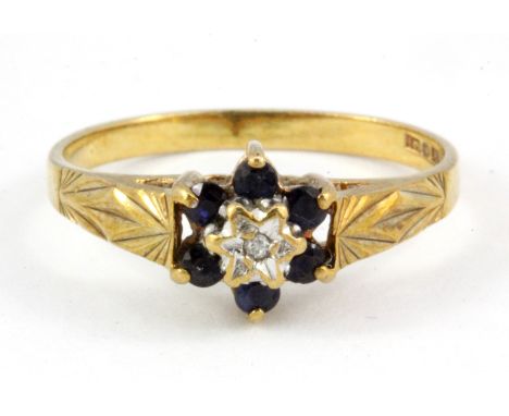 A 9ct yellow gold sapphire an diamond set cluster ring, (R.5).