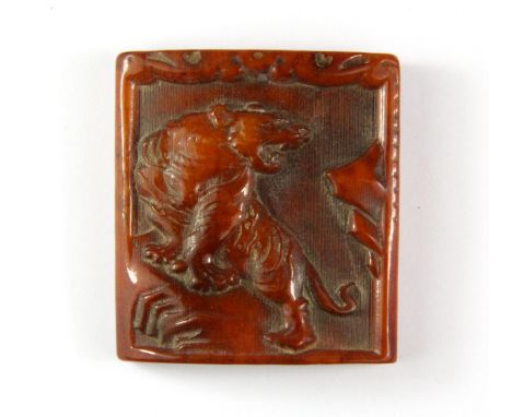 A Tibetan carved yak bone protective tiger amulet, Size. 4.5 x 5cm.