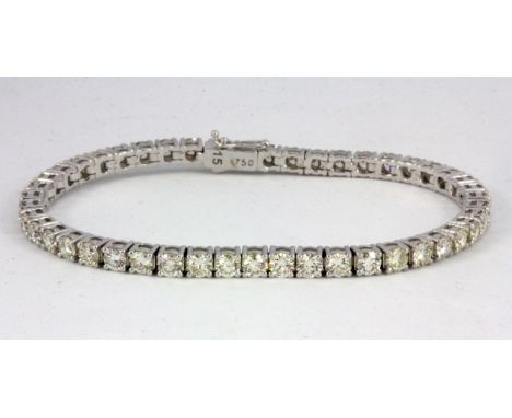 An 18ct white gold diamond set line bracelet, approx. 6.96ct overall.