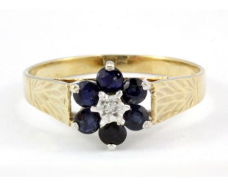 A 9ct yellow gold sapphire an diamond set cluster ring, (R.5).