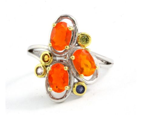 A 925 silver fire opal and other gemstone set ring, (L.5).