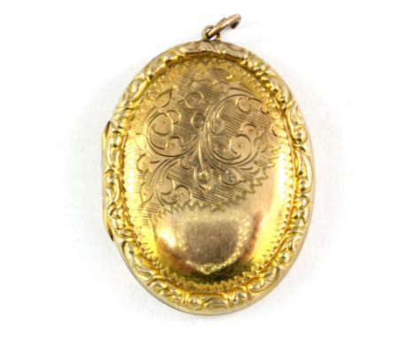 A 9ct yellow gold back and front locket, L. 3.5cm.