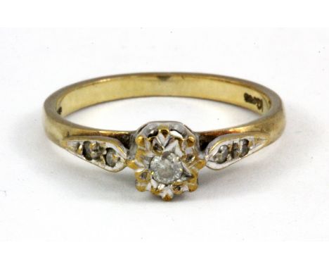 A 9ct yellow gold diamond set solitaire ring, (M.5).