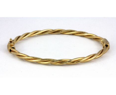 A 9ct yellow gold bangle, L. 6.5cm, W. 10.4g.