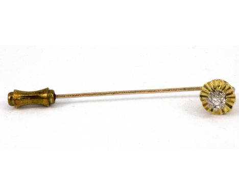 A yellow metal (tested minimum 9ct gold) diamond set stick pin.