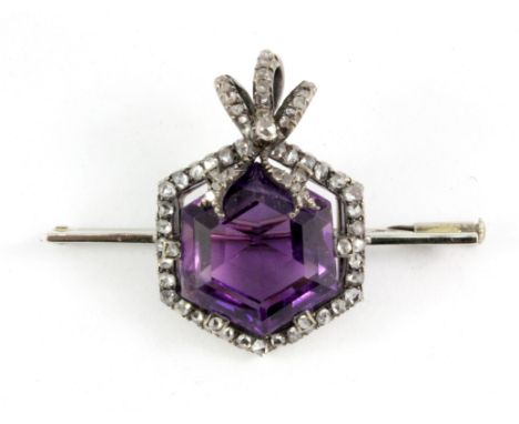 A white metal (tested minimum 9ct white gold) hexagonal amethyst cut and diamond set brooch, L. 5 x 3.5cm.
