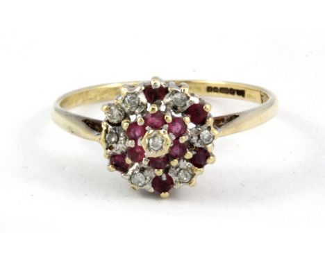 A 9ct yellow gold diamond and ruby set ring, (K.50.