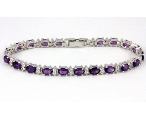 A 925 silver amethyst and white stone set bracelet.