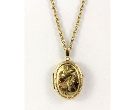 A yellow metal portrait locket pendant on a 9ct yellow gold chain.