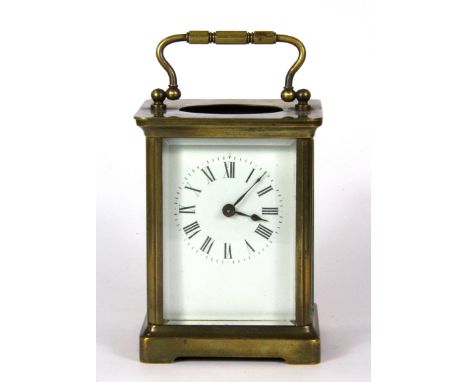 A small brass carriage clock, H. 10cm, (missing top glass).