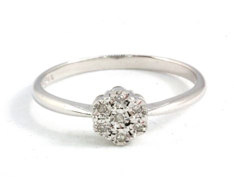 A 9ct white gold diamond set cluster ring, (L.5).