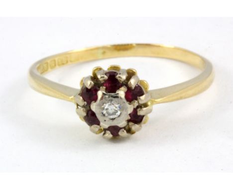 A 9ct yellow gold ruby and diamond set cluster ring, (M).