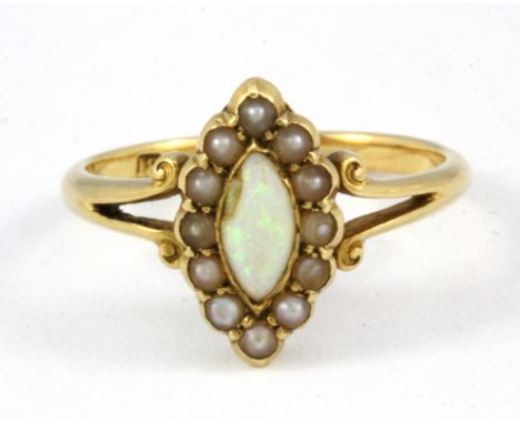 An 18ct yellow gold opal and pearl set cluster ring, (L)&nbsp;W. 15.5g.