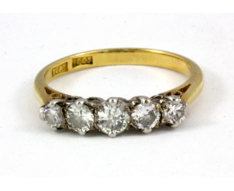 An 18ct yellow gold five diamond set ring, (N).