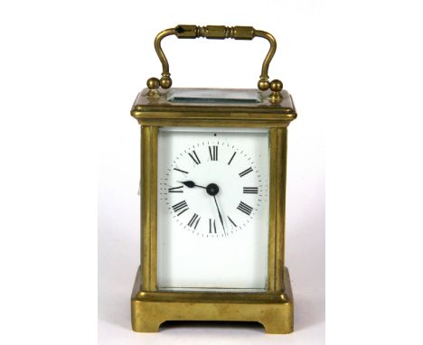 A brass carriage clock, H. 11cm.