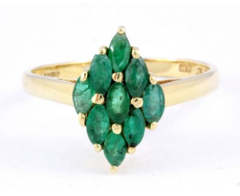 A 9ct yellow gold marquise cut emerald set cluster ring, (Q).