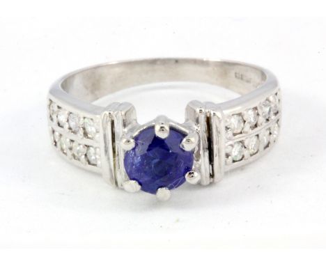 An 18ct white gold diamond and sapphire set ring, (J.5).