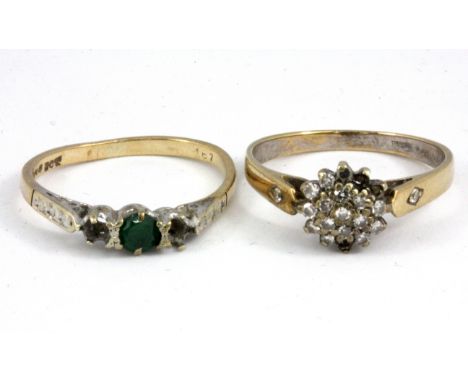 A 9ct yellow gold emerald set ring with a further 9ct gold diamond set cluster ring, (stones missing).