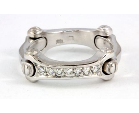 A heavy Cartier style 18ct white gold diamond set ring, (P.5).