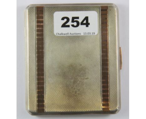 A heavy Art Deco hallmarked silver and gold inlaid cigarette case (approx 108g).