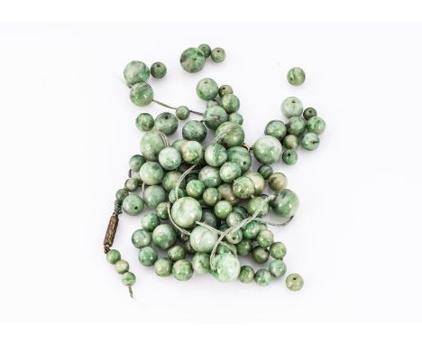 A sting of unstrung jade beads, all circular, (in need of restringing) 64g