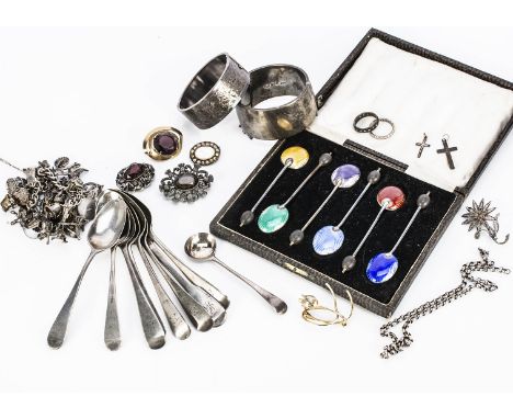 A collection of silver jewels, including a charm bracelet, two bangles, a silver eternity ting with spinels, a collection of 