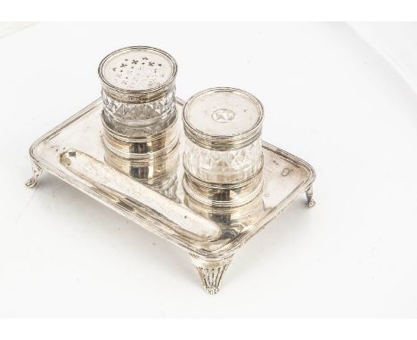 A George III silver ink stand by John Emes, 15.5cm wide, the rectangular base with two applied circular supports for a cut gl