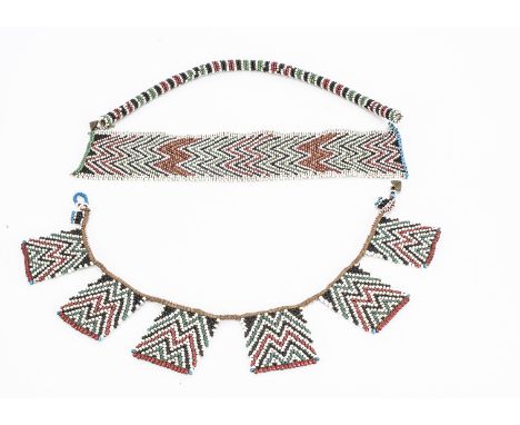 Two African bead work necklaces, of Zulu style, comprising a rectangular panel with chevron design, together with an other wi