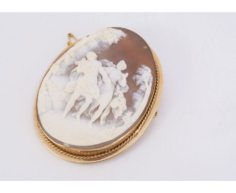 A shell carved cameo brooch,  in a 9ct gold mount, the carved panel with a pair of classical musicians with in a landscape, 6