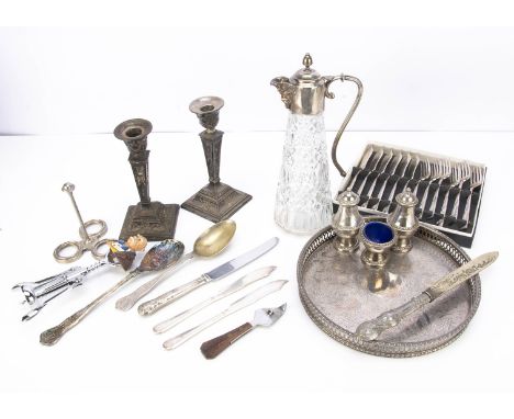 A small collection of silver plate, including a pair of Sheffield plated candlestick, a claret jug and tray, various flatware