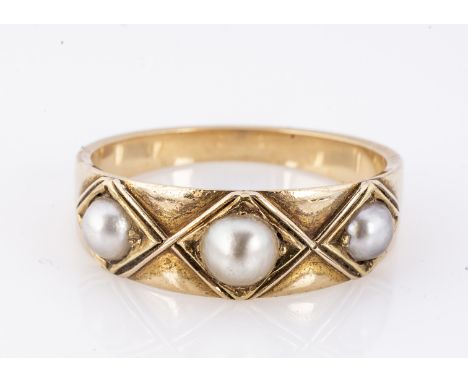 A yellow gold and half pearl ring, the three half cut pearls in lozenge settings, with tapered shank, ring size Q, 4.5g