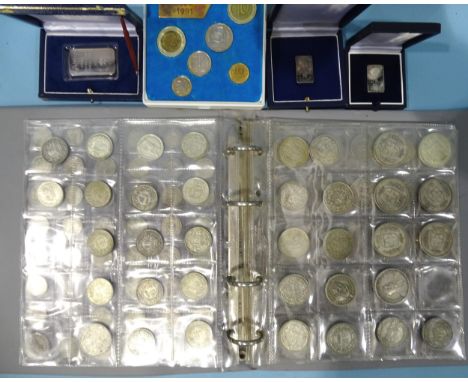 An album of Swiss pre-1968 silver coinage, comprising: ½F (x44), 1F (x22), 2F (x16), 5F (x7), approximately 485g, together wi