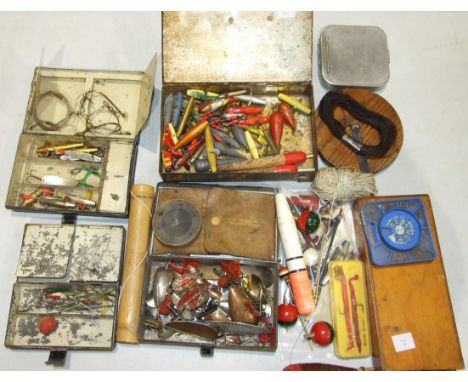 A collection of lures and decoy minnows, an alloy cast tin and other fishing accessories.