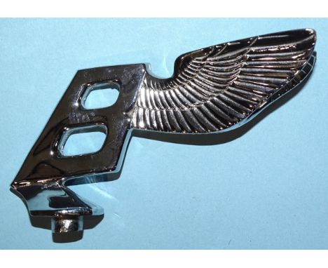 A Bentley winged 'B' mascot, the 'B' leaning backwards, indistinctly-stamped Reg 883907 (possibly), 13cm.