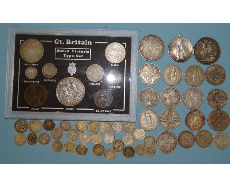 A collection of British pre-1920 silver coinage, including a George IV 1821 crown (a/f), Victoria 1896 crown, 1887 double-flo