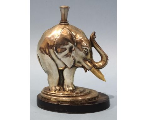 A mid-20th century Ronson chrome-plated elephant touch-tip table lighter, with striker, on oval base, 13cm high.