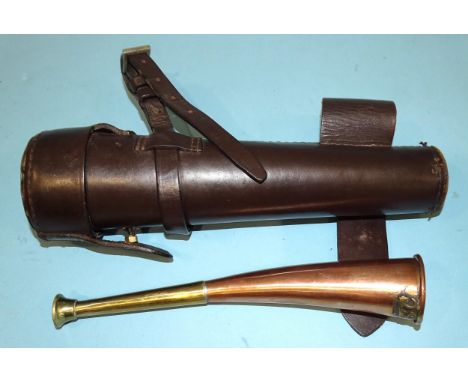 A brass and copper hunting horn, 24cm, in a leather holster marked Scott and Cooper, Bath.