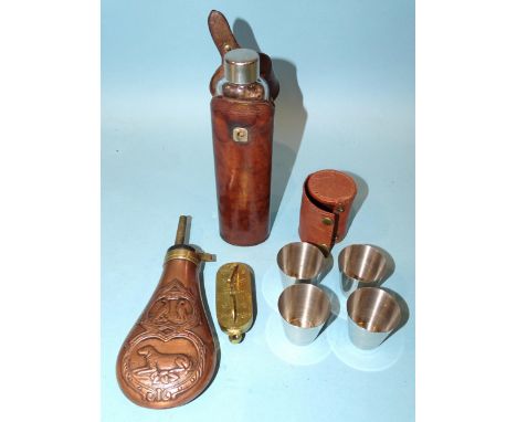 A copper and brass shot flask decorated with hounds and game birds, 18cm, a modern brass game counter, 7.5cm, a glass bottle,