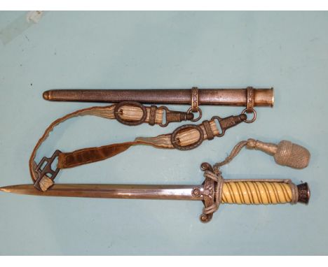 A WWII German army officer's dagger with white celluloid grip, pommel with oak leaves relief, cross guard in the form of an a