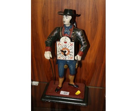 A VINTAGE CAST METAL FIGURATIVE MANTLE CLOCK