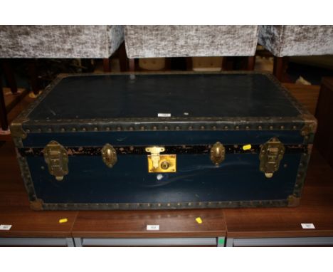 A VINTAGE BANDED PACKING TRUNK