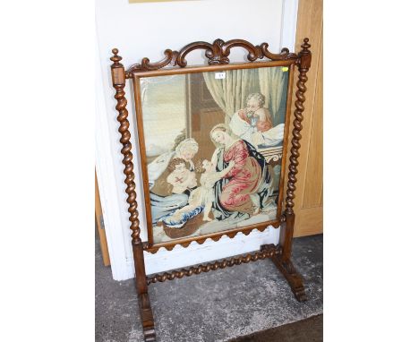 A VICTORIAN BARLEY TWIST FIRESCREEN WITH EMBROIDERED PANEL H-75 W-117 CM