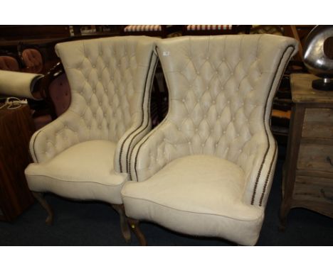 A PAIR OF MODERN CREAM LEATHER BUTTON BACKED UPHOLSTERED ARMCHAIRS (2)