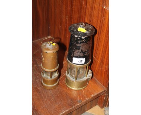 A VINTAGE PRESTWICH PATENT MINERS LAMP TOGETHER WITH A SMALLER EXAMPLE