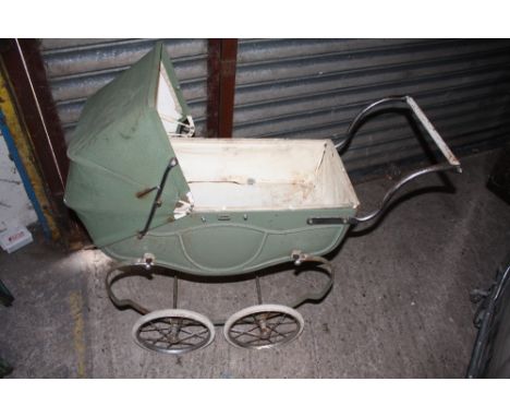 A VINTAGE GREEN METAL DOLLS PRAM 